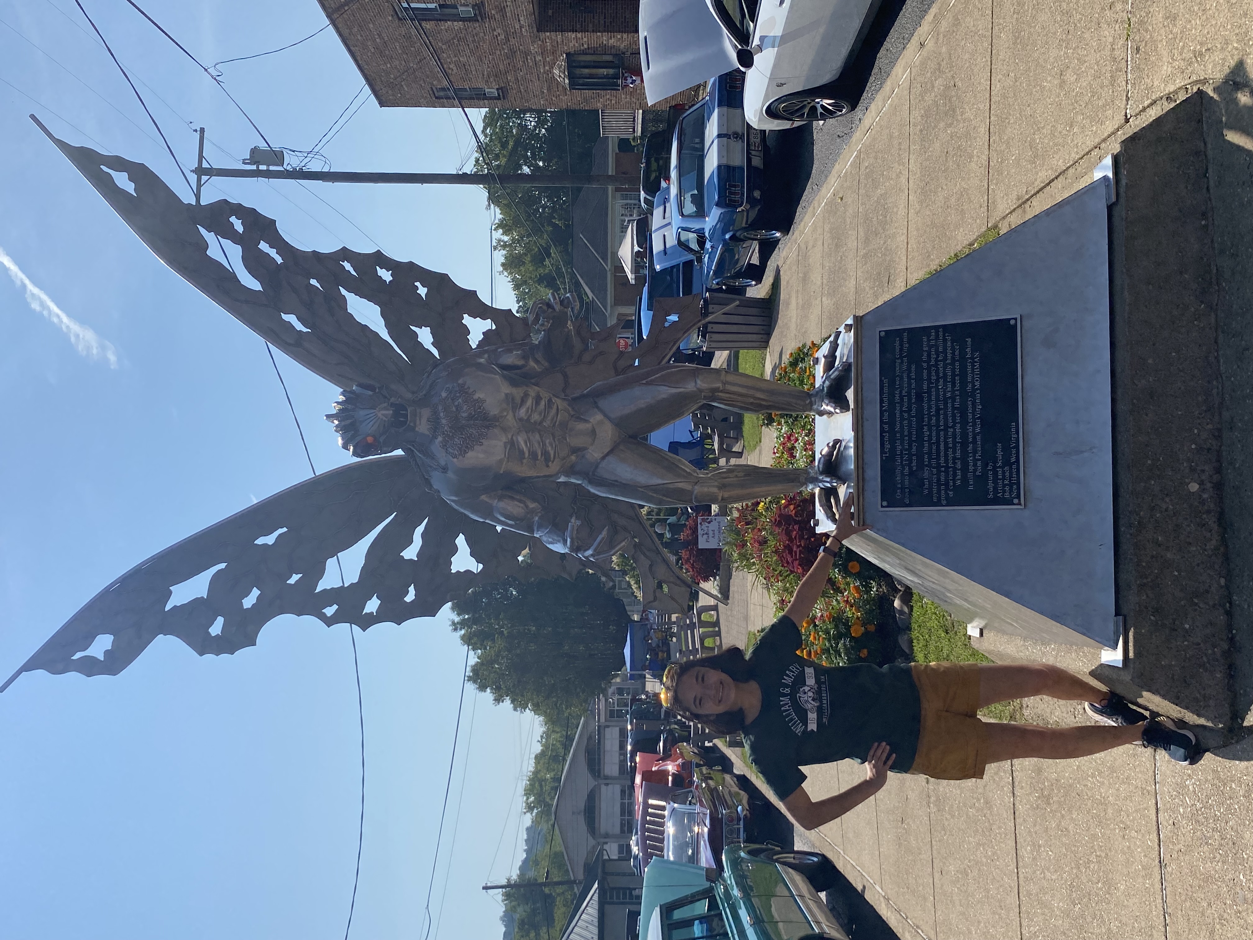 Elena standing with the Mothman statue, July 2022